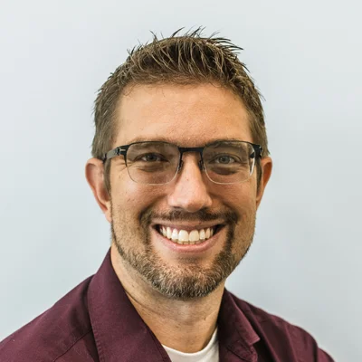 A headshot photo of Dr. Jordan Dau, an optometrist at Dau Family Eye Care